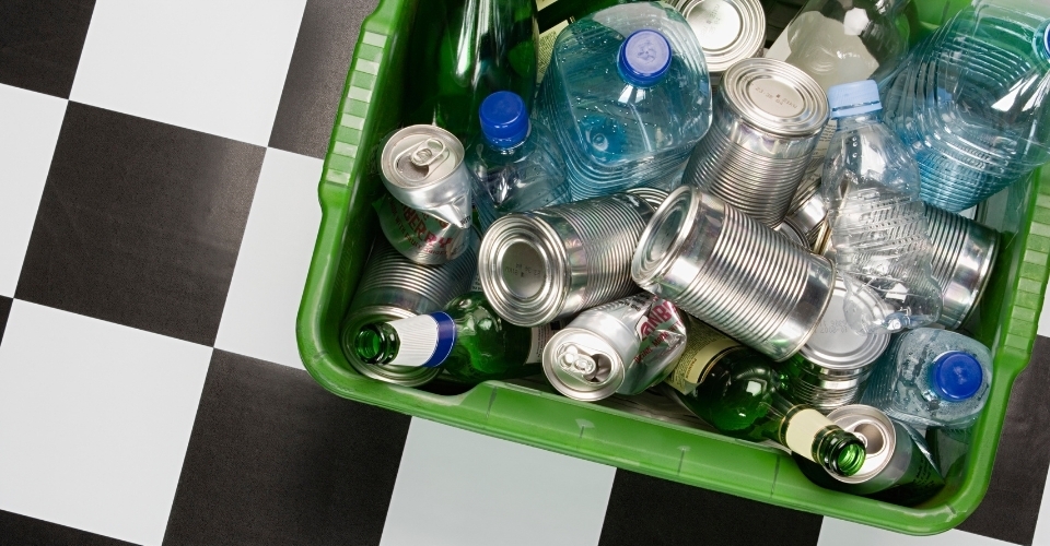 Used cans & bottles in a container