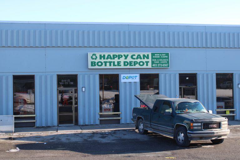 Happy can bottle depot storefront with a car parked in the parking lot