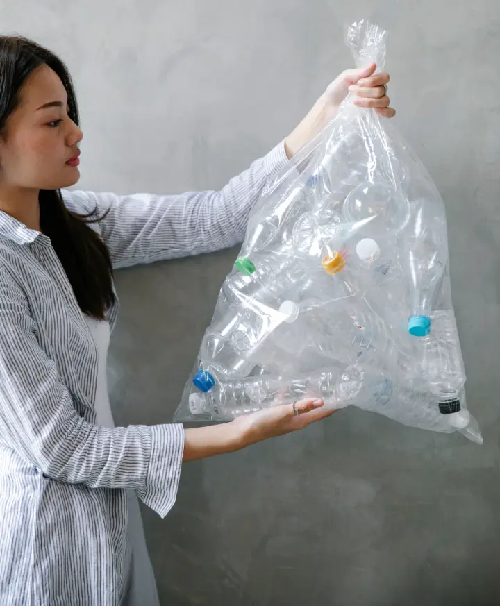 A woman with a recycling polythene in her hands